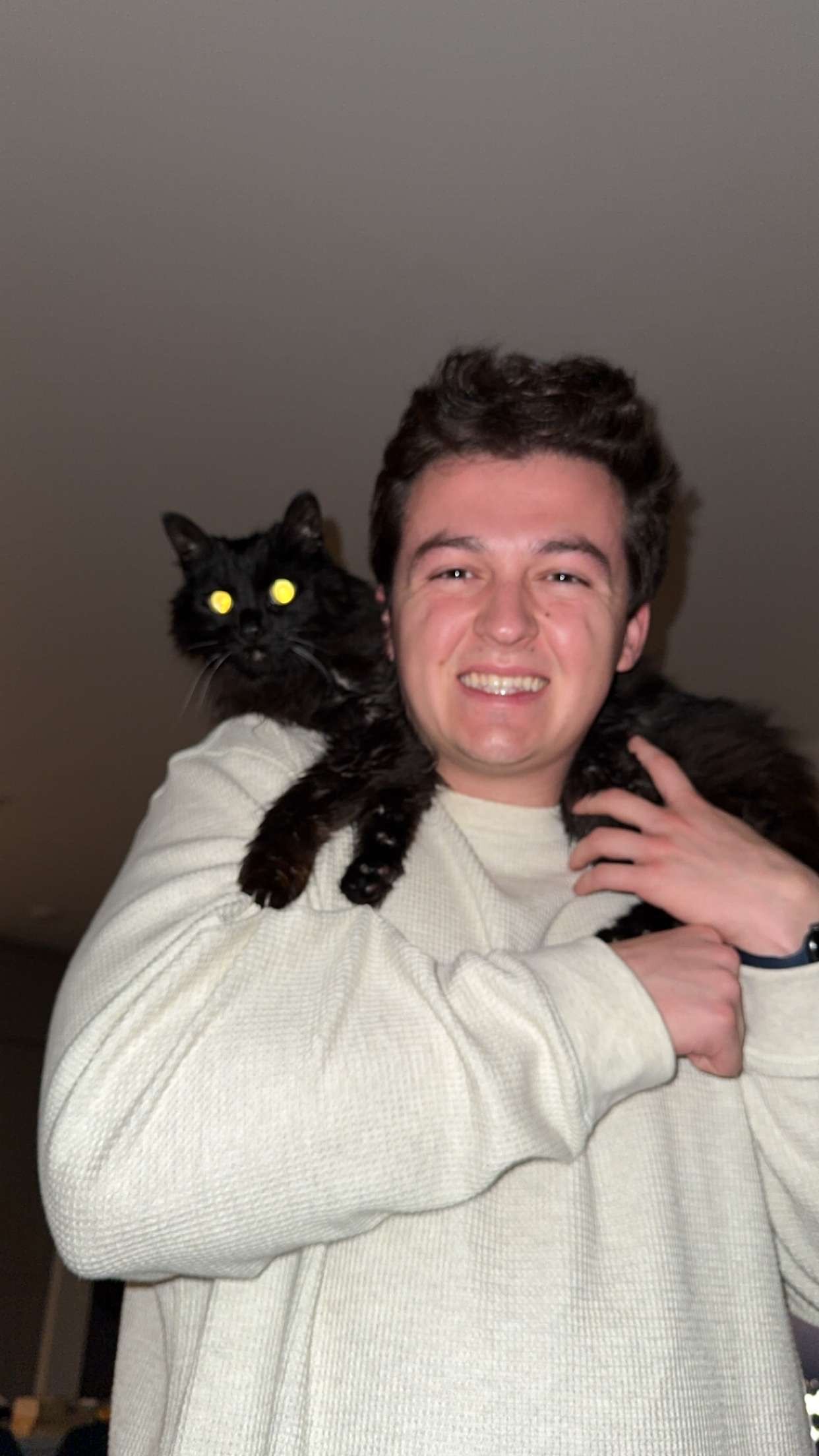 Charlie Steinman holding his cat Shadow