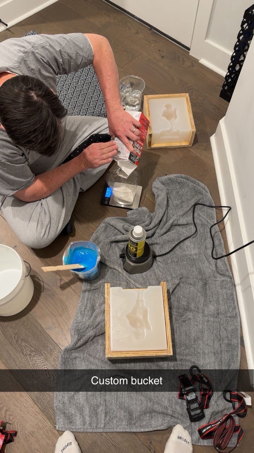 Mixing and pouring plaster into a custom mold box