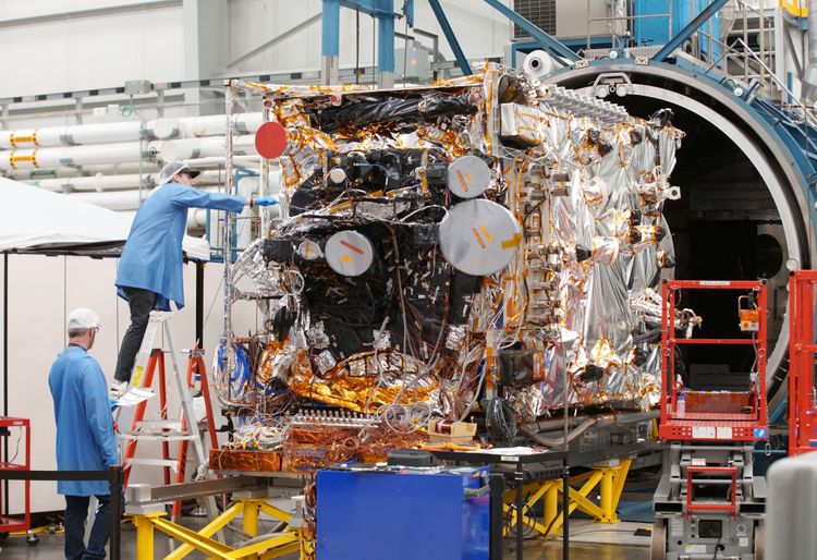 Spacecraft hardware in thermal vacuum chamber