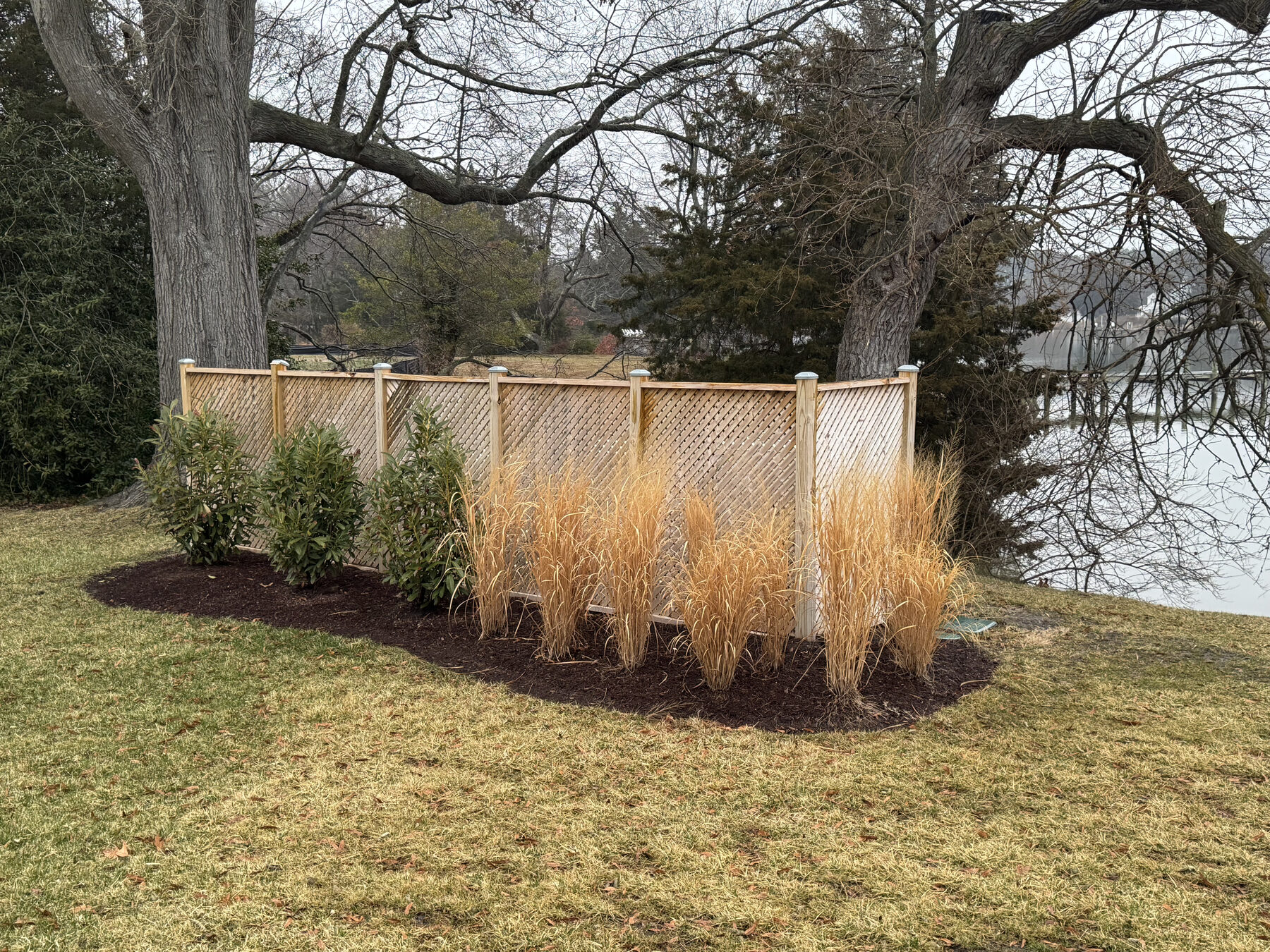 Pool equipment fence — finished with shrubbery